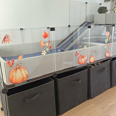 C&C cage with clear panels decorated with reusable autumn vinyl stickers