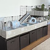 C&C cage with clear panels decorated with reusable snowflake vinyl stickers